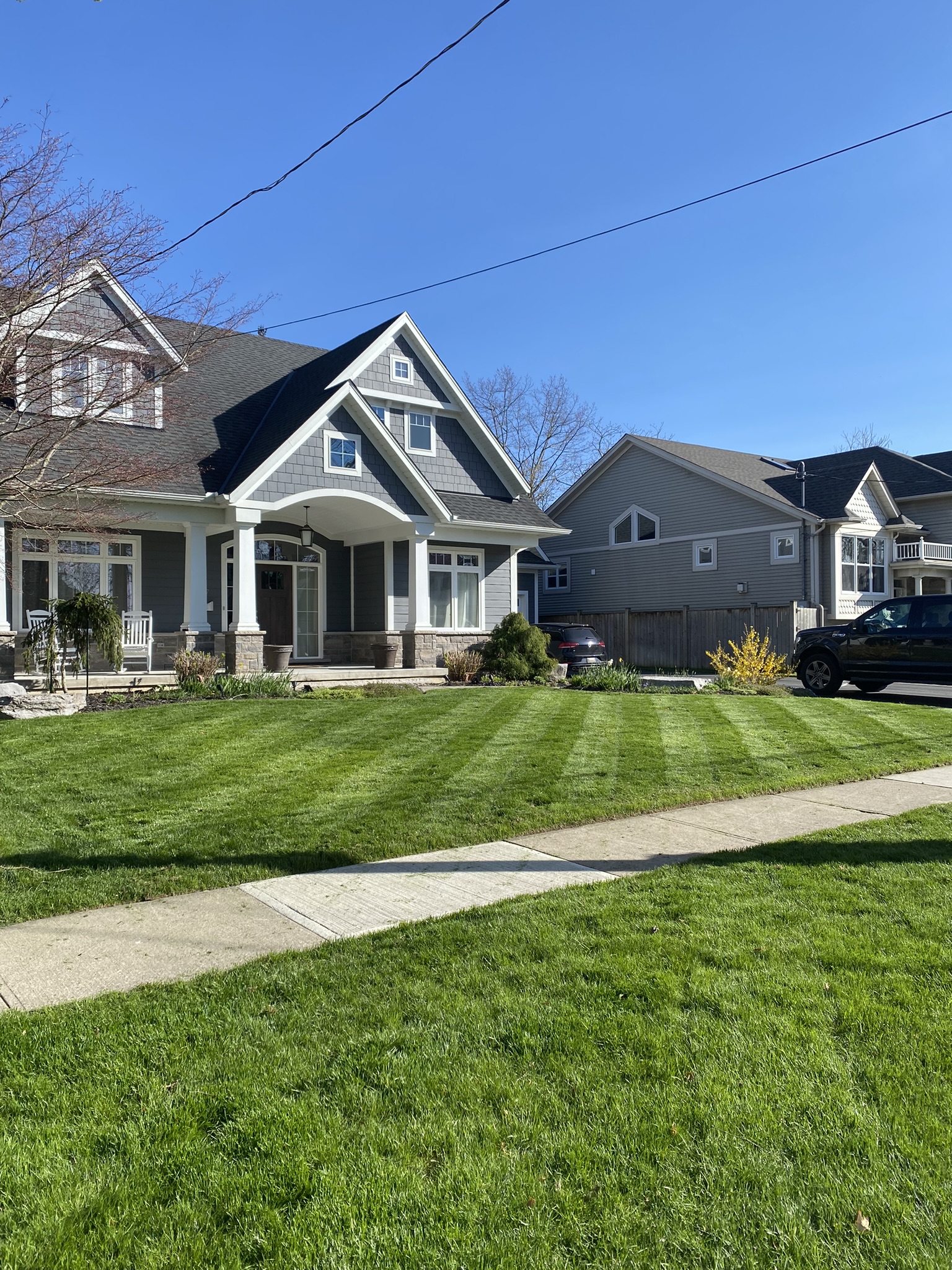 Professionally mowed lawn on a residential street