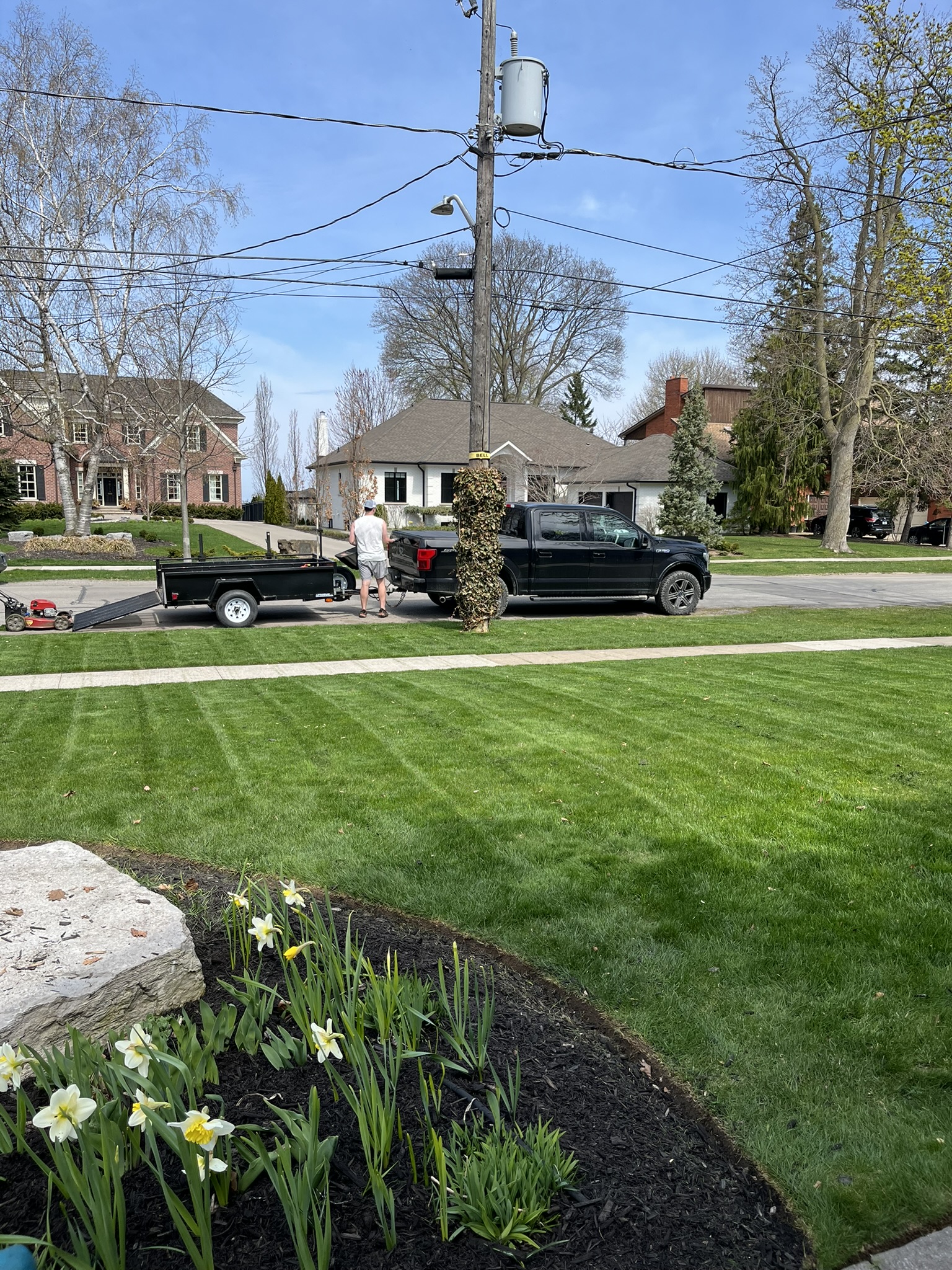 Crew on site with freshly striped lawn